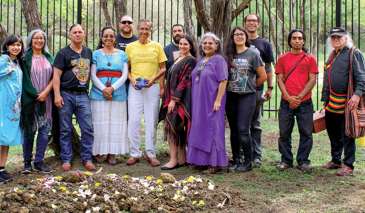 A large group of Indigenous people posing for a photo