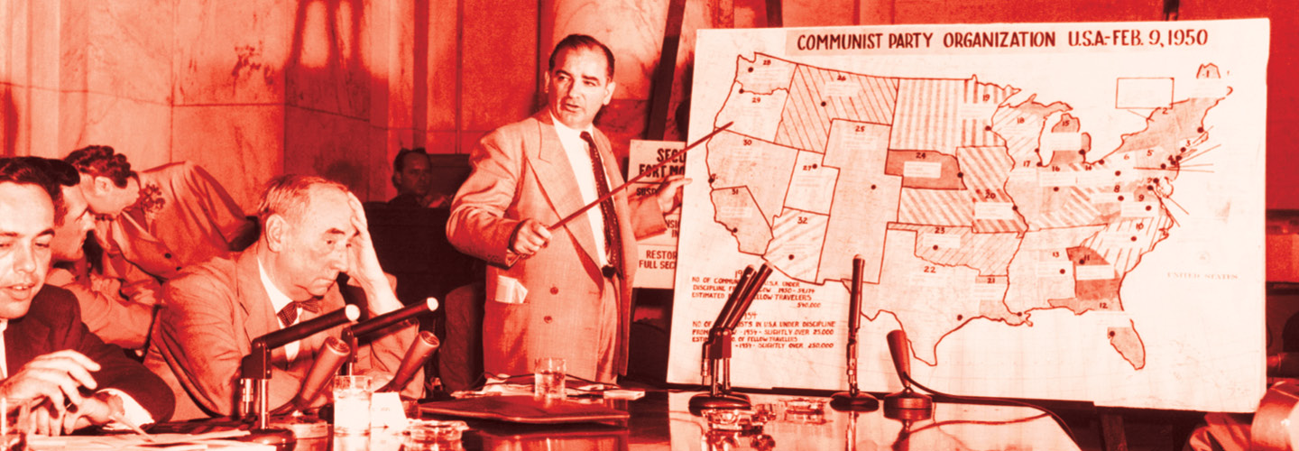 Joseph McCarthy speaking in front of a room