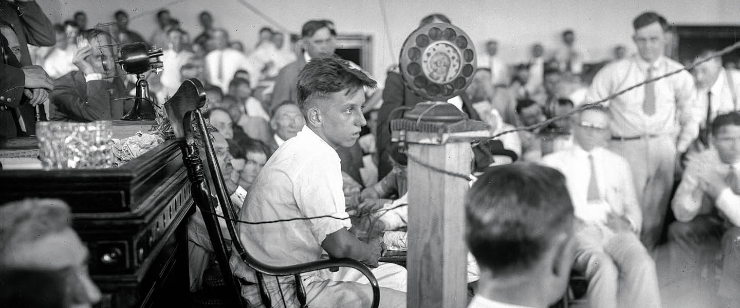 Black & white photo of a room full of students