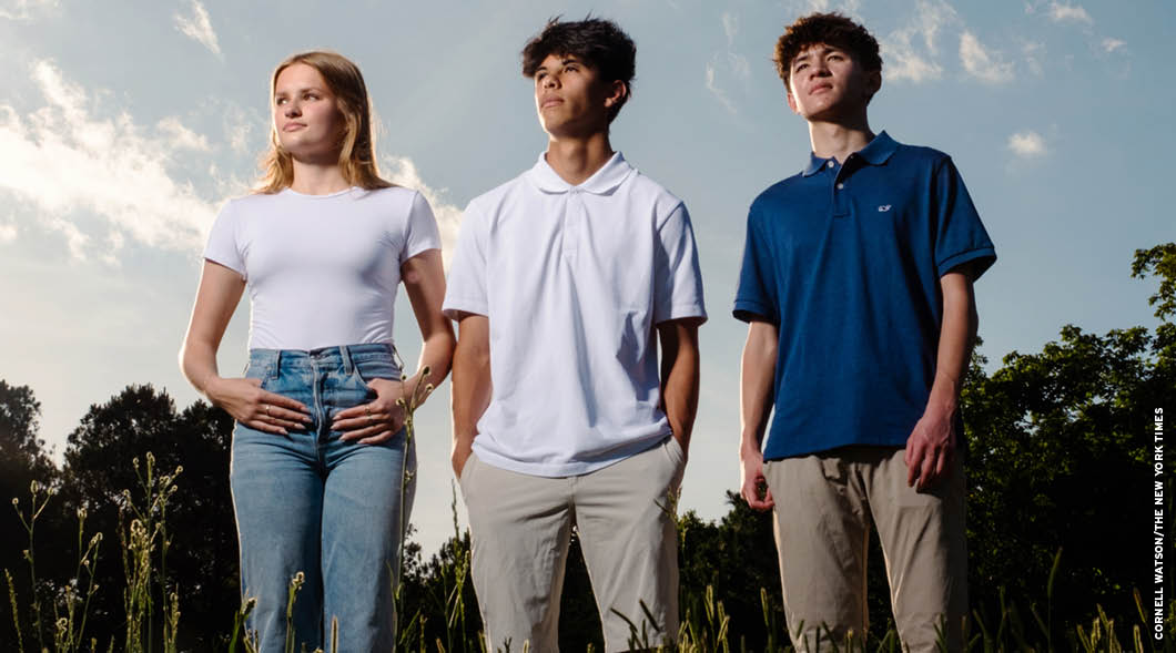 Photo of three teens posing together