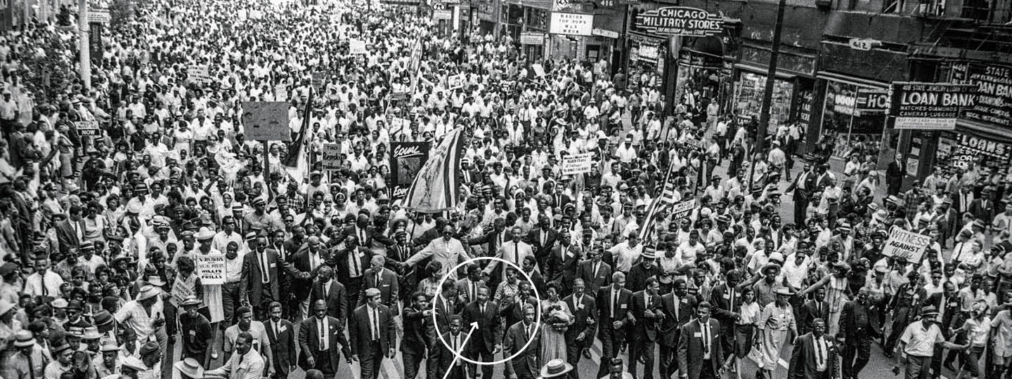 Black & white photo of a large crowd of people marching for Black Equality